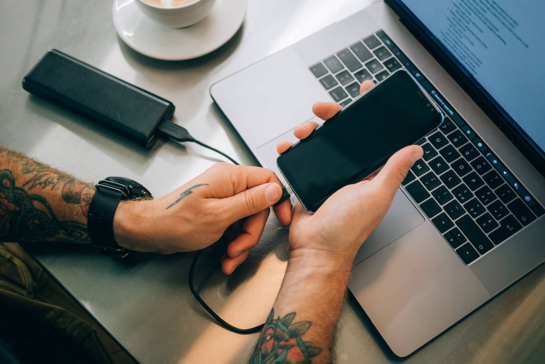 Man Plug In Phone Into Battery Pack DDQHSGD 70