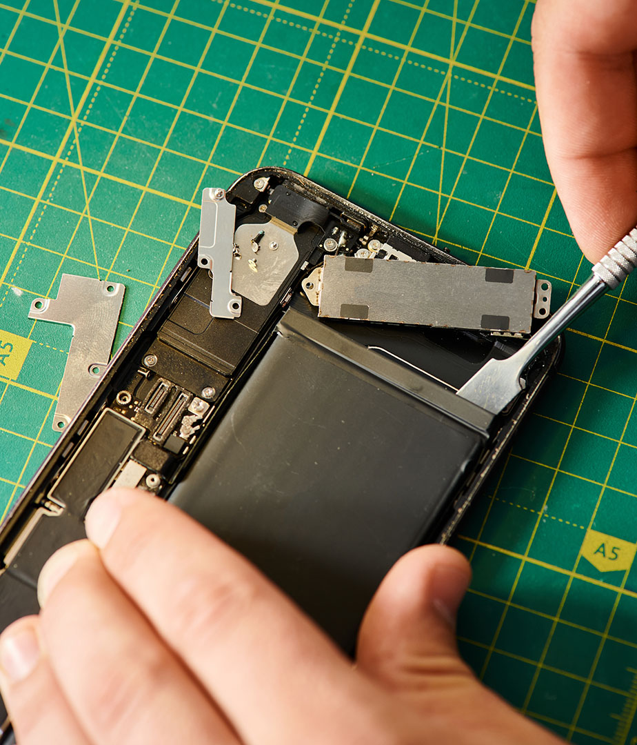 cropped-view-of-technician-opening-smartphone-duri-2026-03-11-04-18-24-utc