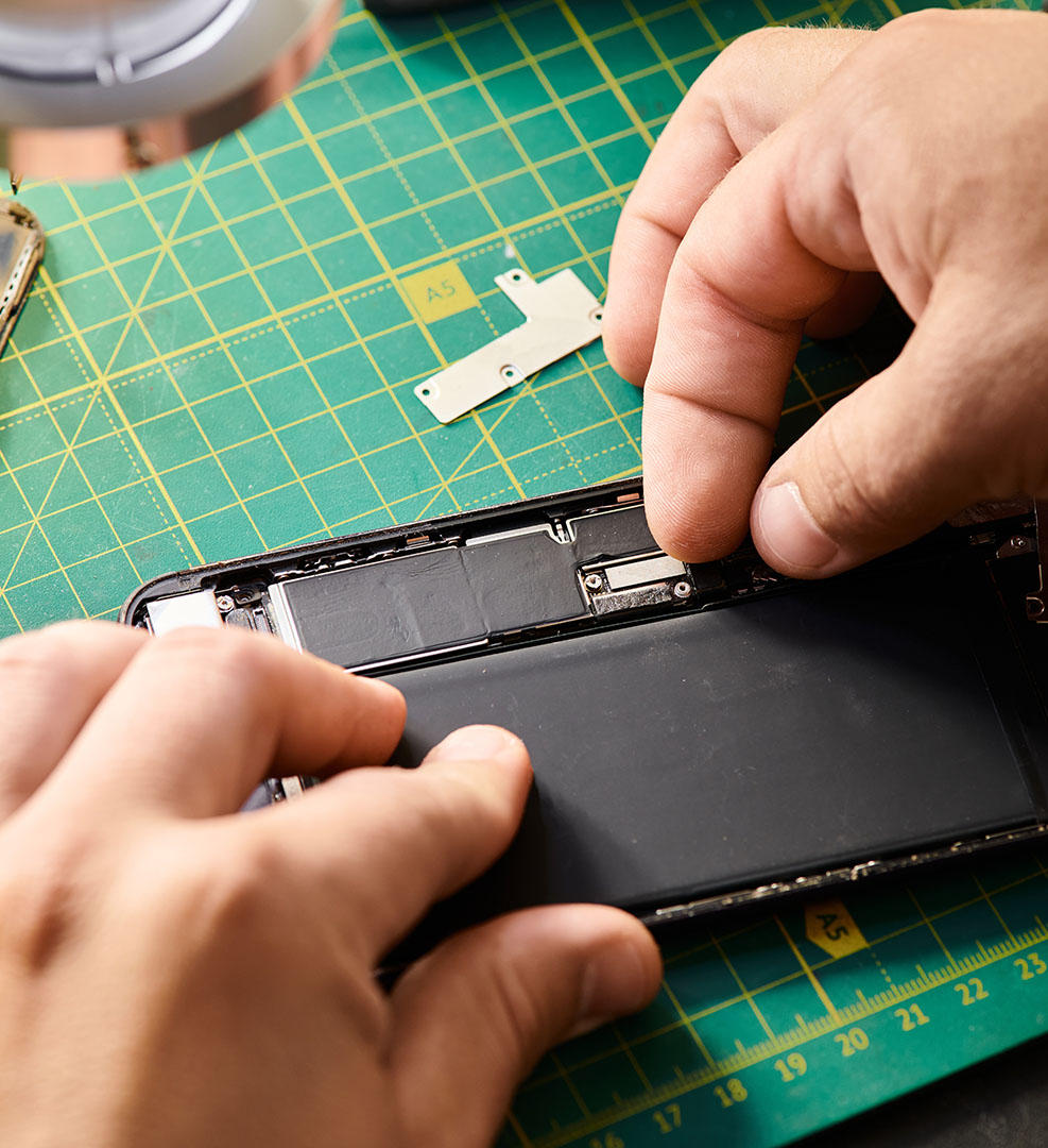 partial-view-of-technician-assembling-mobile-phone-2026-03-25-10-43-44-utc